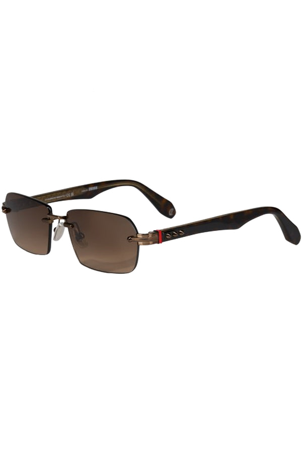 Rotated view of Christian Louboutin sunglasses in brown with metal frame, shown against a plaid white background.
