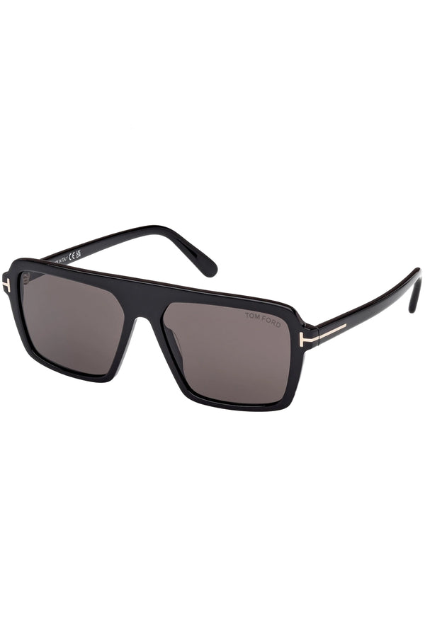 Rotated view of Tom Ford rectangular sunglasses in gray with black frame and metal T detail, shown against plaid white background.